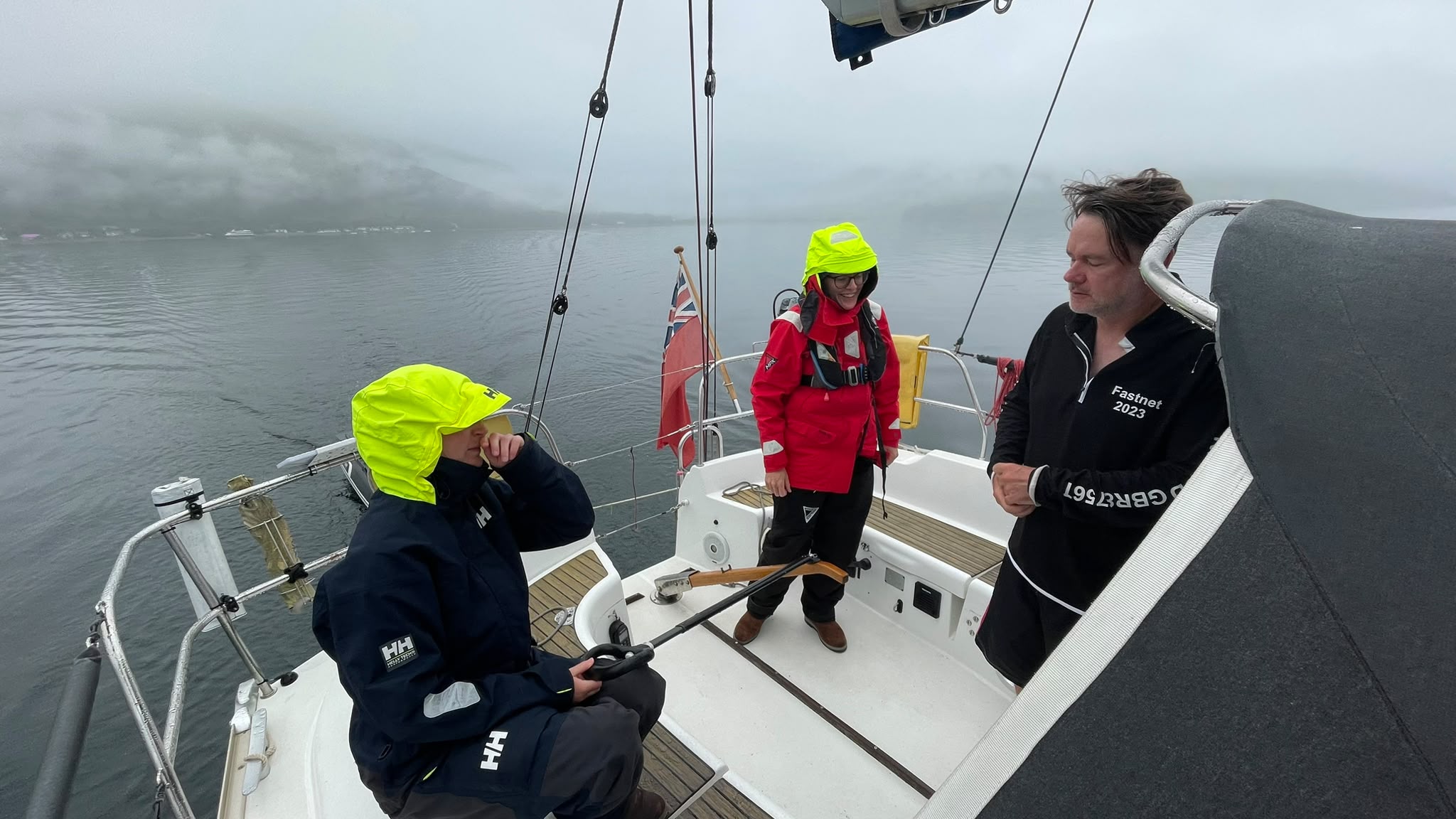 Crew working together on Nimrod in wet weather