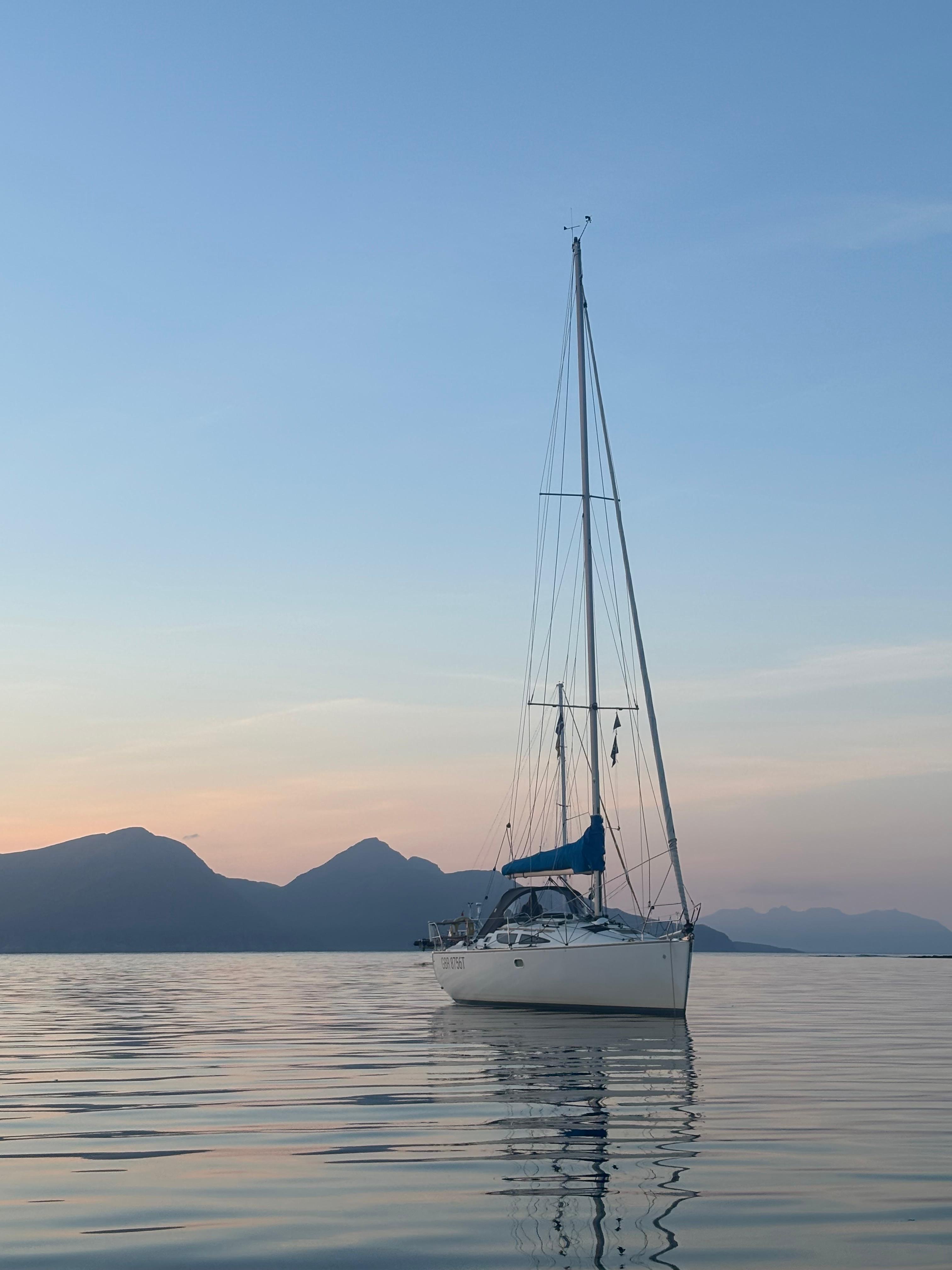 Nimrod at anchor in calm water at sunset